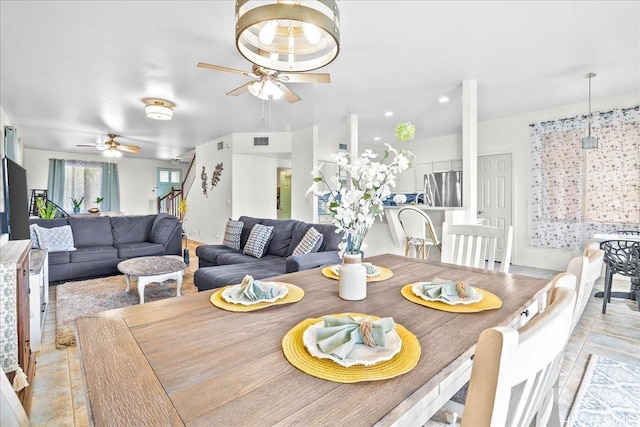 dining room with visible vents and a ceiling fan