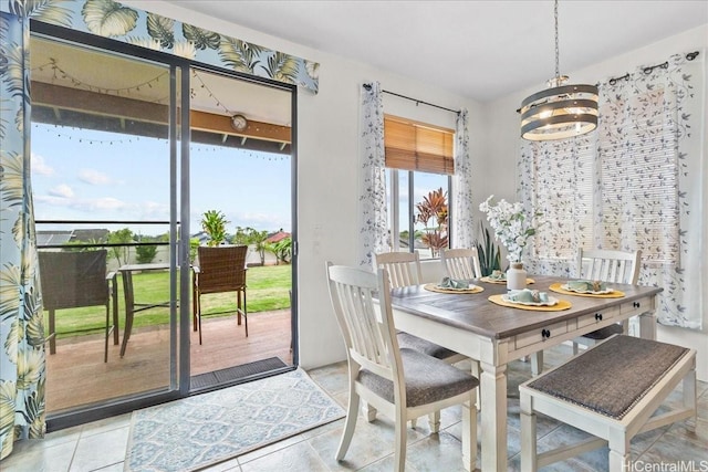 dining space with a chandelier