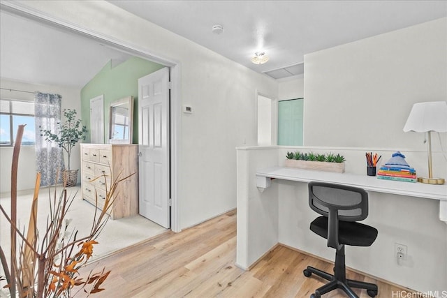 office with light wood-style floors