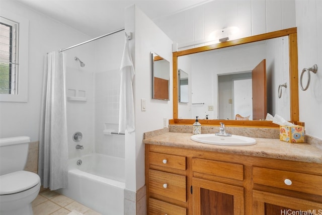 bathroom with toilet, tile patterned floors, shower / bath combo with shower curtain, and vanity