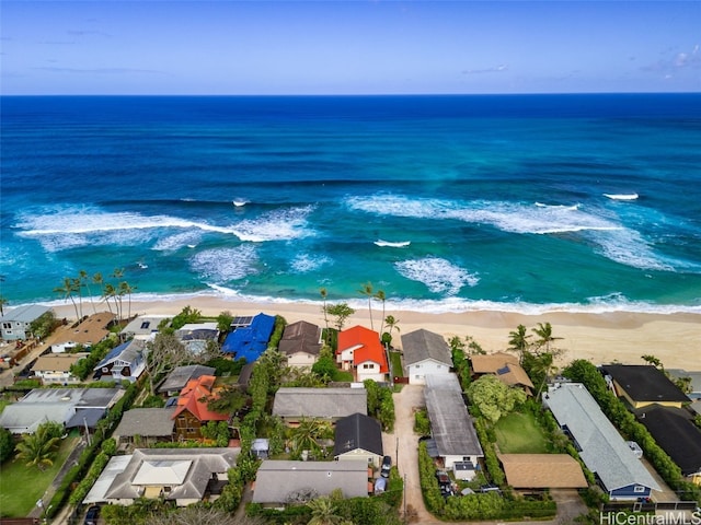 aerial view featuring a water view, a residential view, and a beach view