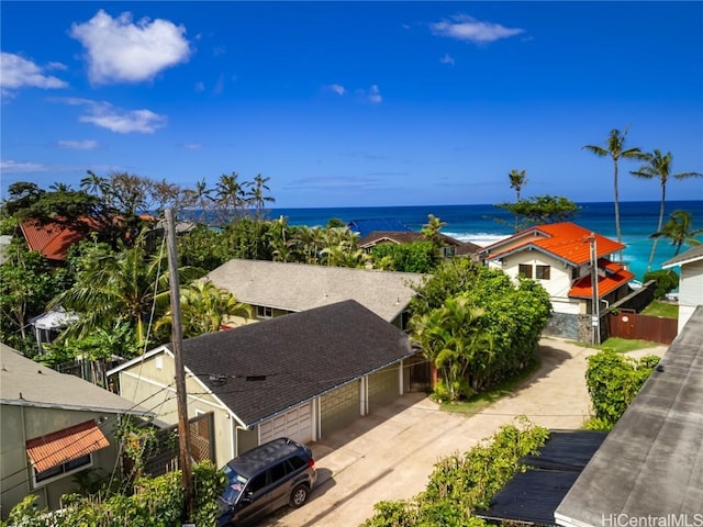 birds eye view of property with a water view