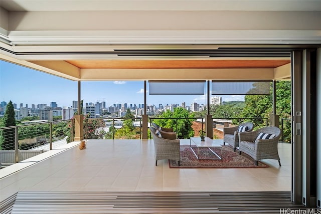 interior space featuring a balcony and a city view