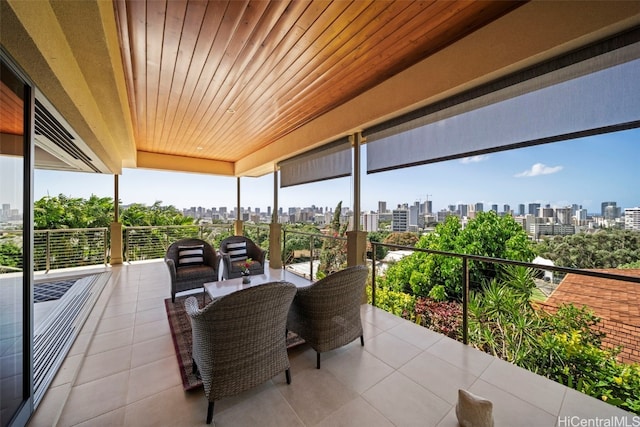 view of patio featuring a city view and a balcony