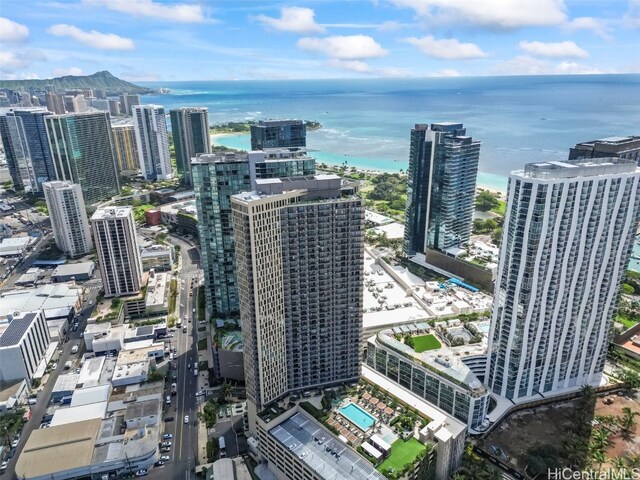 birds eye view of property featuring a view of city and a water view