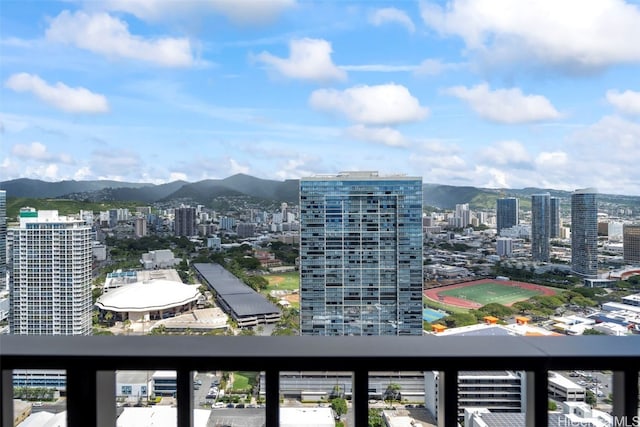 balcony with a view of city and a mountain view