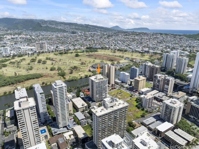 birds eye view of property with a city view and a water view