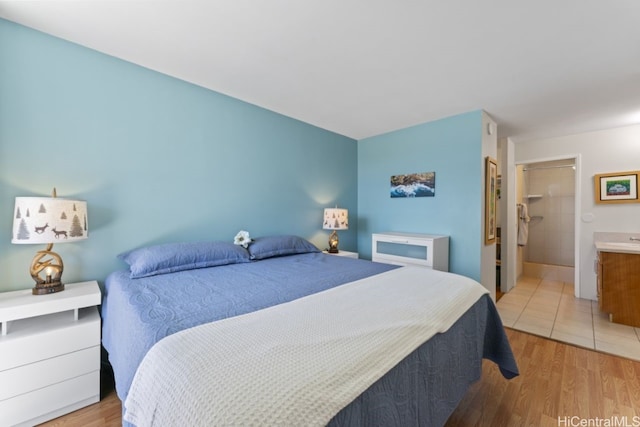 bedroom featuring light wood-style floors