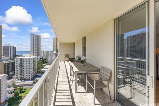 balcony with a city view and a water view