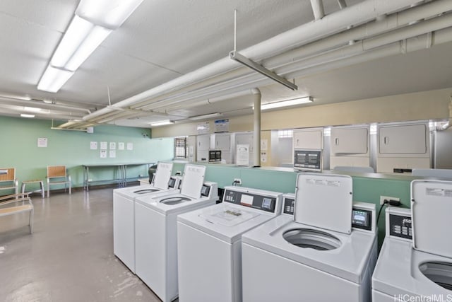 shared laundry area with washing machine and clothes dryer