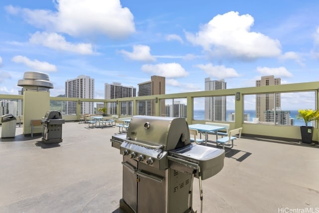 view of patio / terrace featuring a city view and a grill