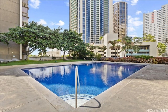 community pool with a city view