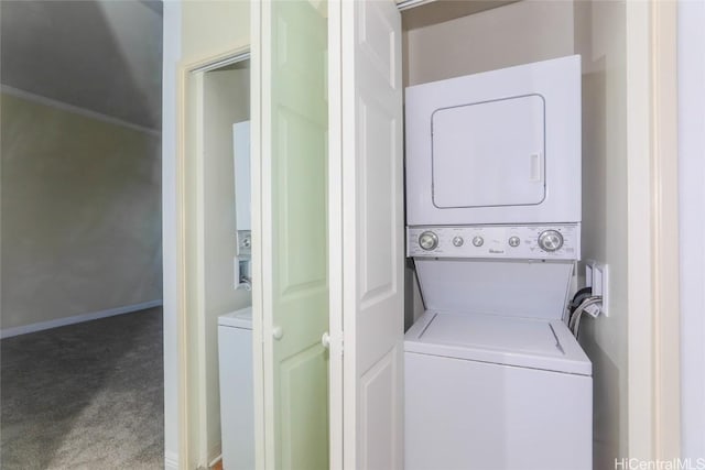 washroom featuring stacked washing maching and dryer and carpet flooring