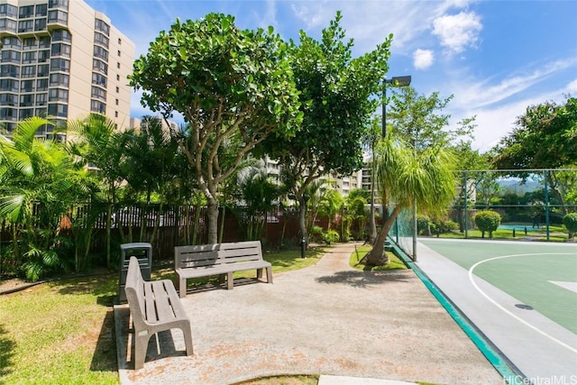 view of community featuring basketball hoop