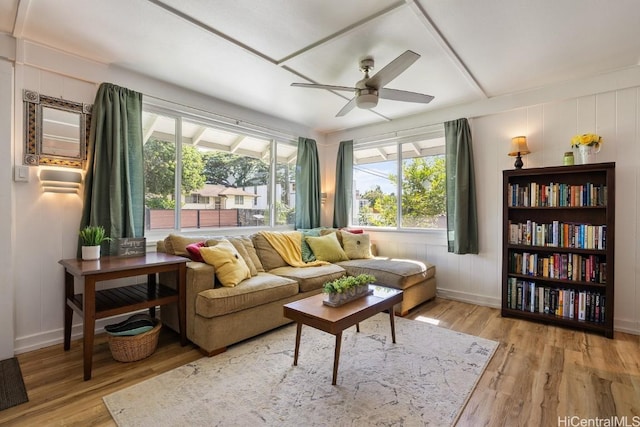 sunroom featuring a ceiling fan