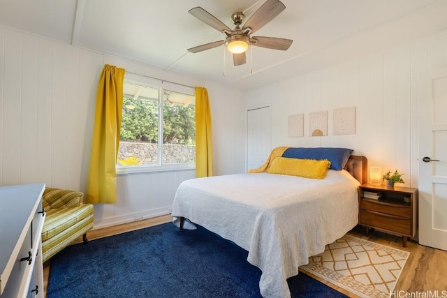 bedroom featuring ceiling fan and wood finished floors