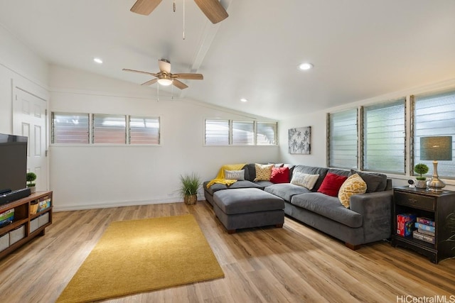 living area with vaulted ceiling, light wood-type flooring, and recessed lighting