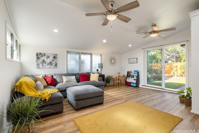 living room featuring lofted ceiling, ceiling fan, wood finished floors, and recessed lighting