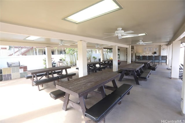 view of patio / terrace with a ceiling fan and outdoor dining space