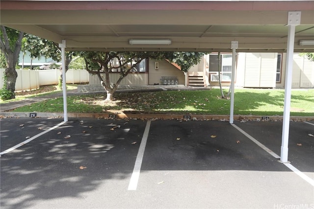 covered parking lot with fence