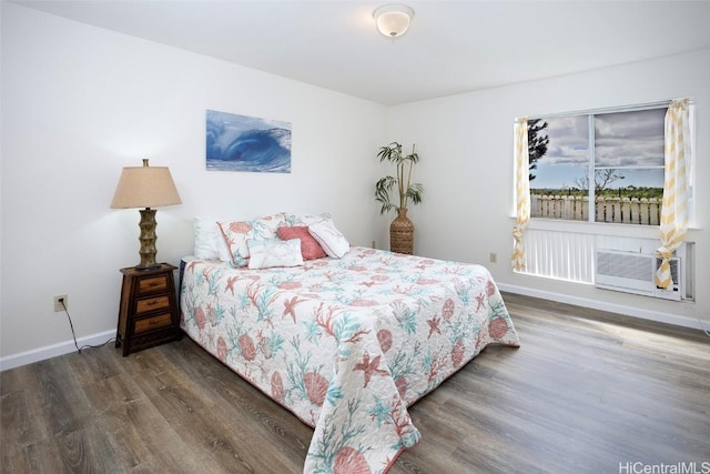 bedroom with dark wood-type flooring