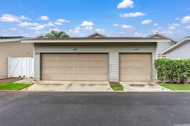 garage with fence