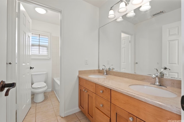 full bath featuring toilet, a sink, tile patterned floors, and visible vents