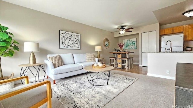 living room with dark carpet and ceiling fan