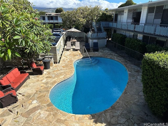 view of swimming pool with a patio