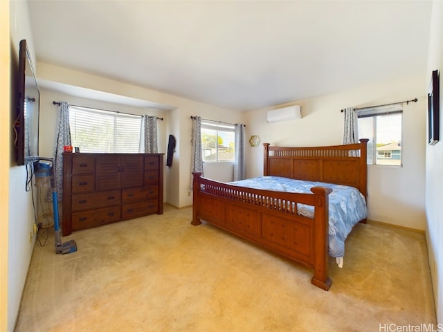 bedroom featuring a wall mounted AC and light colored carpet