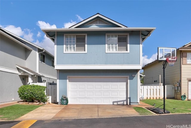 view of front facade featuring an attached garage, fence, and concrete driveway