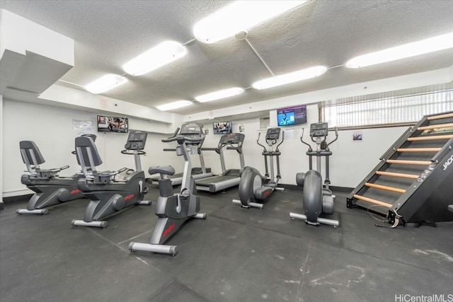 gym with a textured ceiling