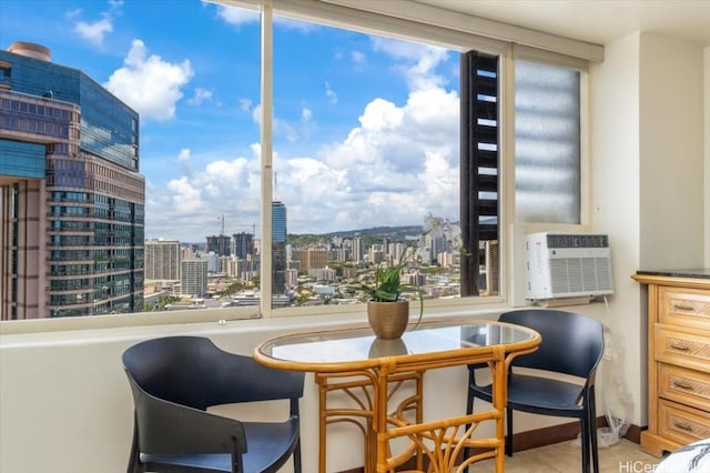 interior space with a view of city and an AC wall unit