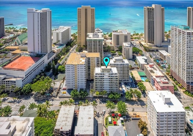 drone / aerial view with a city view and a water view