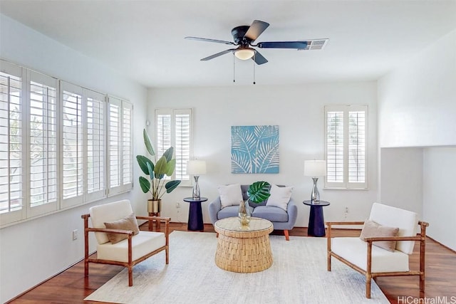 sitting room featuring ceiling fan and wood finished floors