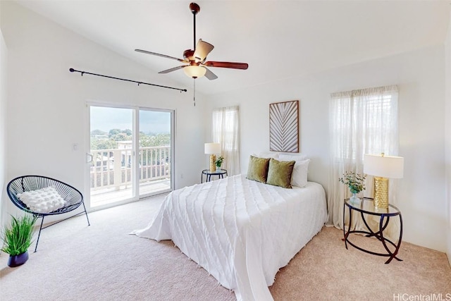 bedroom featuring vaulted ceiling, access to outside, carpet flooring, and a ceiling fan