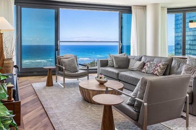 living room with a water view and wood finished floors