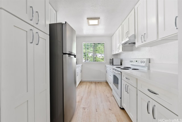 kitchen featuring light countertops, light wood-style flooring, appliances with stainless steel finishes, white cabinetry, and under cabinet range hood