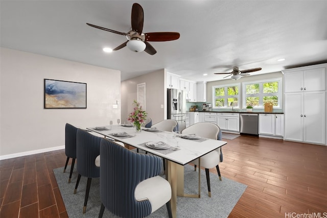 dining area featuring ceiling fan, baseboards, dark wood-type flooring, and recessed lighting