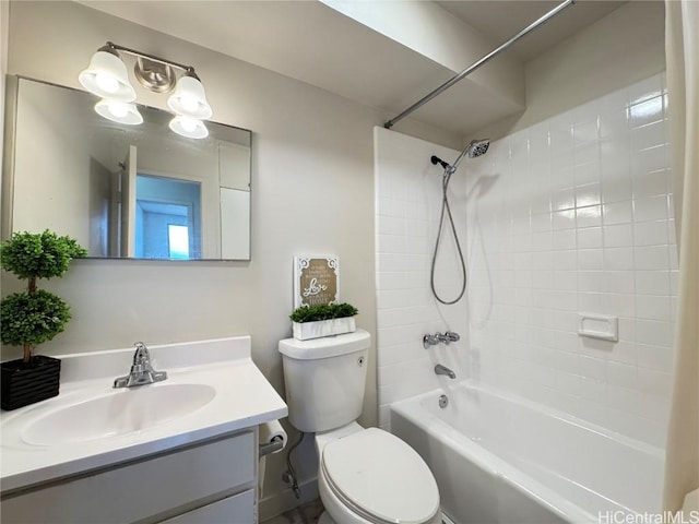 full bathroom featuring toilet, vanity, and shower / washtub combination