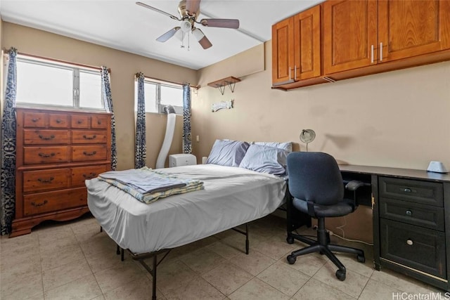 bedroom featuring light tile patterned floors and ceiling fan