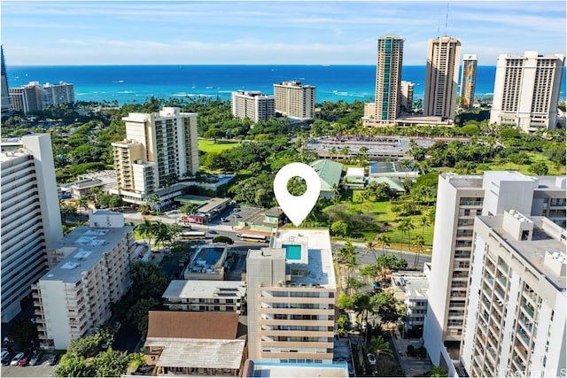 birds eye view of property featuring a water view and a view of city