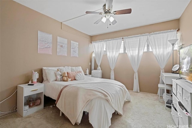 bedroom with light carpet and ceiling fan