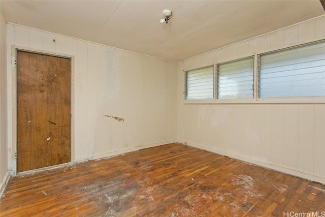 empty room with dark wood finished floors