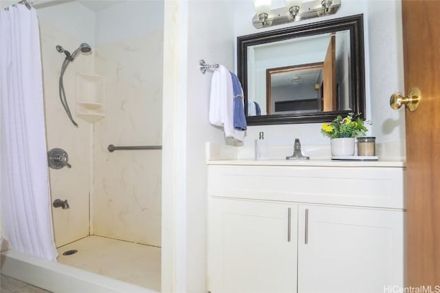 full bathroom featuring a shower stall and vanity