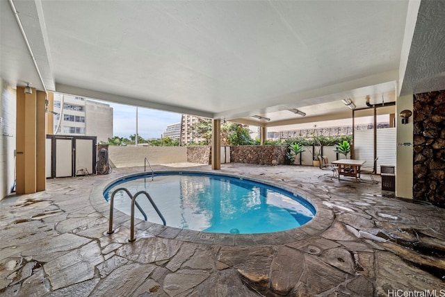 view of swimming pool featuring a fenced in pool, a patio area, and a fenced backyard