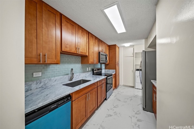 kitchen featuring a sink, decorative backsplash, marble finish floor, appliances with stainless steel finishes, and brown cabinets