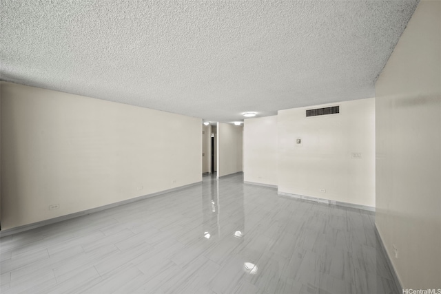 1561 Kanunu St Unit 801, Honolulu, HI 96814 - empty room featuring a textured ceiling and baseboards