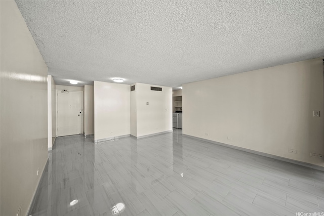 1561 Kanunu St Unit 801, Honolulu, HI 96814 - spare room featuring a textured ceiling and baseboards