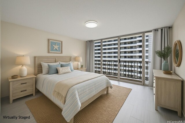 1561 Kanunu St Unit 801, Honolulu, HI 96814 - bedroom with floor to ceiling windows and access to outside